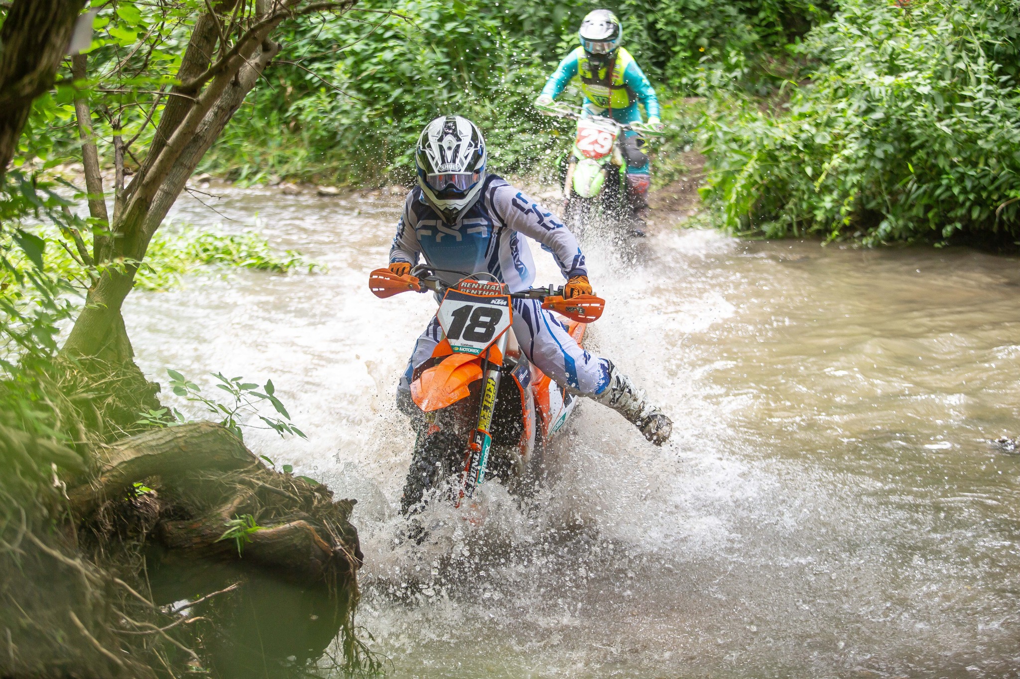 May be an image of 3 people, motorcycle, dirt bike and text