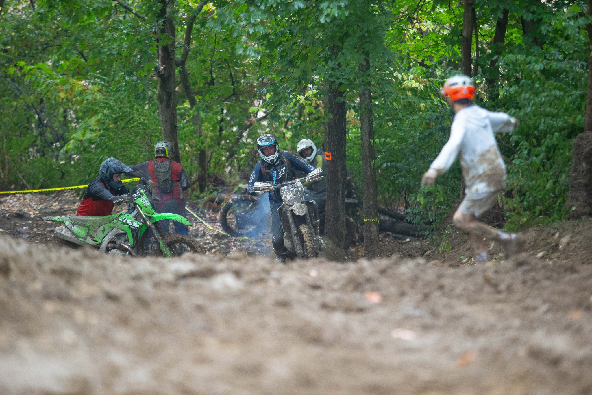 May be an image of 3 people, motorcycle, dirt bike and text